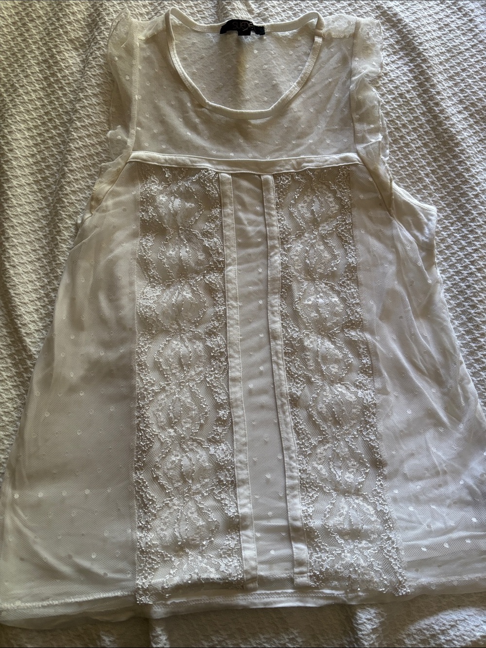 Women’s sleeveless white lace top